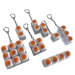 Exclusivité transfrontalière : Porte-clés mignon en forme de pain au caramel avec son de clic mécanique, pour la relaxation et le transport quotidien - Product Image 1
