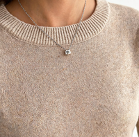Ensemble deux pièces en tricot de haute qualité pour femmes, col rond, manches longues, jupe midi à fente latérale, couleur unie, coupe classique, tenue décontractée