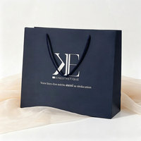 Wholesale Custom Embossed Logo Gift Hand Tote Shopping Bags With Luxury Ribbon Handle Reusable Hard Paper T-Shirt Shopping Bag