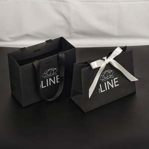 Custom Logo Embossing Printed Clothing Cardboard Retail Paper Shopping <b>Bag</b> Luxury Gift Packaging Paper <b>Bags</b> With Handle Rope - Product Image 1