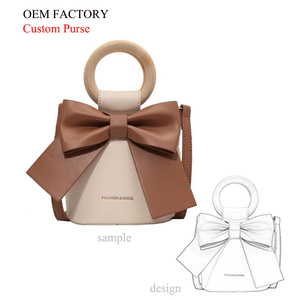 Vente en gros de sacs à main Fashion Girls Drawstring Mini Bucket Lolita Bag Single Shoulder avec poignée ronde et nœud - Product Image 1
