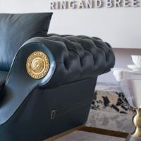Canapé modulaire en cuir de luxe italien au design original, avec boutons, pieds en acier inoxydable et rembourrage en éponge, idéal pour hôtels et villas.