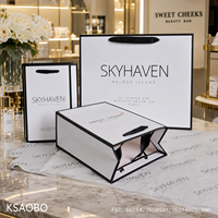 Sac en papier personnalisé avec logo pour vêtements, sac de shopping blanc de luxe avec poignée en ruban pour boutique, vente en gros