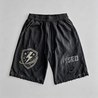 Shorts imprimés Black Shield en coton épais, bords déchirés, effet vintage, style urbain, OEM ODM acceptés, livraison rapide