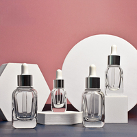 Vente en gros de flacons compte-gouttes carrés de haute qualité de la marque Doully, 10 ml à 40 ml, bouchon à vis, fond épais, verre, impression d'écran, logo personnalisé