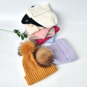 Chapeaux tricotés en laine pour femmes d'hiver en gros avec <span class=keywords><strong>pompon</strong></span> en vraie fourrure chapeau chaud à rayures personnalisé à larges poignets chapeau de ski simple à la mode - Product Image 6