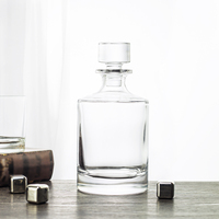 Decantador de whisky redondo de cristal de lujo con tapón de vidrio Fábrica al por mayor para uso doméstico