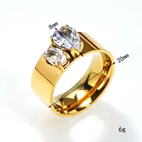 Zwei ovale, blau- und klarfarbene Zirkonia-Steine in Goldton eingelegt, Edelstahl-Mode-Ring, poliert, breites Band, Unisex, Alltagsschmuck