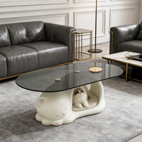 Table basse en FRP avec base creuse en forme de chat adorable et plateau en verre élégant alliant fonctionnalité et mignonnerie