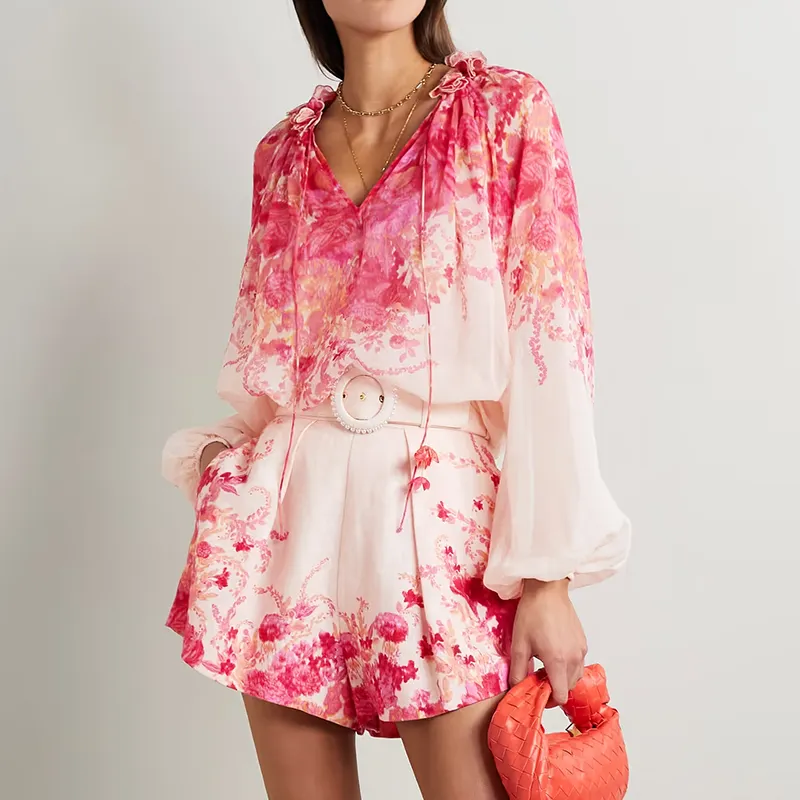 Pink and beige floral pattern belted high-waisted belt that falls to loose leg belted pleated floral print linen suit