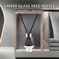 Bouteille diffuseur à roseaux ronde en verre transparent ambré de luxe, scellée au liège, estampillée à chaud, 50 ml, marque SNA, pour vente en gros et approvisionnement en vrac