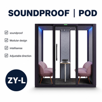 Cabine de réunion insonorisée avec porte vitrée, éclairage LED, panneau acoustique et table pour appels d'équipe en toute intimité