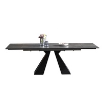 Table à manger minimaliste italienne en céramique revêtue de poudre noire avec deux panneaux d'extension à glissière de couleur marbre moderne extensible