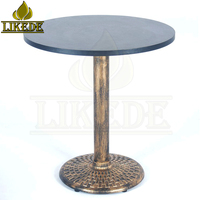 Table ronde en fonte et laiton style antique, base en métal