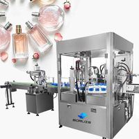 Machine automatique de remplissage, sertissage et collogation de flacons de parfum en verre