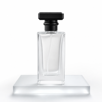 Flacon de parfum vide de luxe rectangulaire en verre transparent avec capuchon géométrique noir, pulvérisateur à fine brume et base épaisse pour emballage de parfum