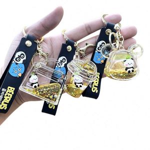 Porte-clés et pendentifs de sac en acrylique, avec liquide flottant noir et or et sable mouvant en bouteille flottante, pour clés de voiture, de fabrication industrielle - Product Image 1