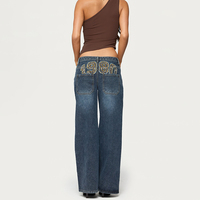 Jean vintage ample pour femme avec broderie effet vieilli, taille basse et coupe droite