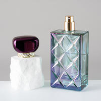 Producción en Masa de Botellas de Perfume de Vidrio Vacías Iridiscentes de 100 ml con Tapa Metálica Morada para Perfume de Mujer