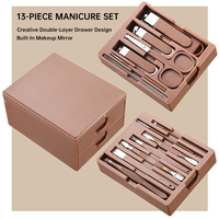 Ensemble de manucure professionnel 13 pièces en acier inoxydable avec tiroir double couche et miroir intégré, incluant coupe-ongles et outils pour cuticules