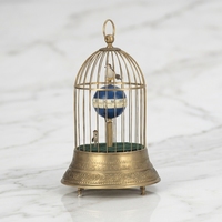 Horloge de cage à oiseaux en laiton avec automaton en forme d'oiseau