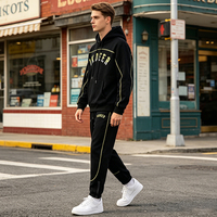 Ensemble de survêtement pour homme en tissu Scuba avec passepoil contrastant, fentes latérales zippées, détails de poignets et chevilles élastiques, comprenant un sweat à capuche oversize et un pantalon de jogging