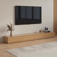 Console TV et table basse tout-en-un, unité fine à poser au sol pour les maisons modernes et compactes, style minimaliste et rangement intelligent