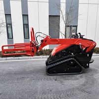 Mini-chargeuse compacte sur chenilles avec moteur Kubota et accessoires hydrauliques de préhension de balles pour l'agriculture et l'aménagement paysager