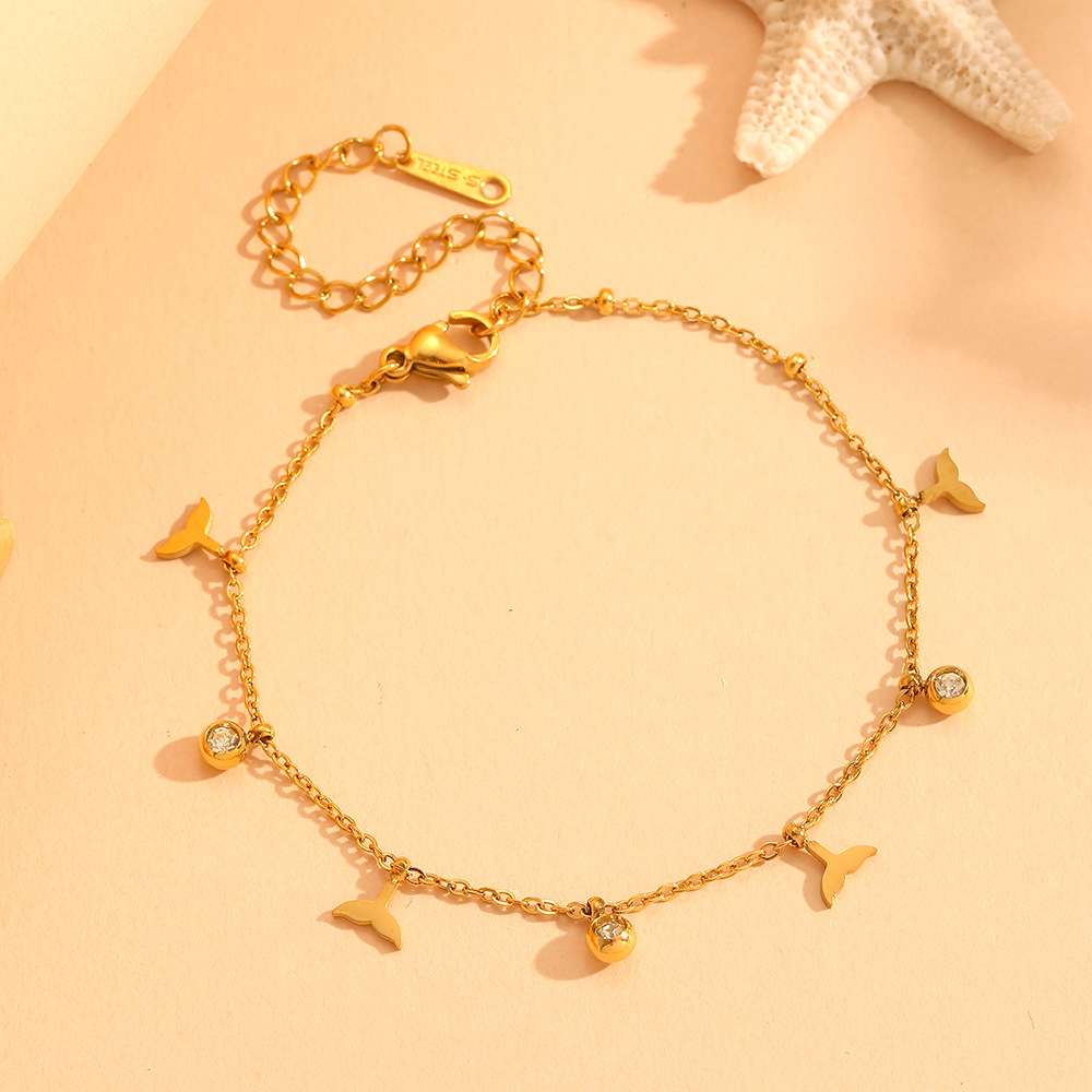 Bracciali multipli a coda di pesce con diamanti