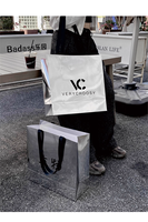 Sac à provisions en carton argenté de luxe pour magasin de détail de vêtements Sacs en papier avec logo personnalisé et poignée de ruban imprimé avec logos