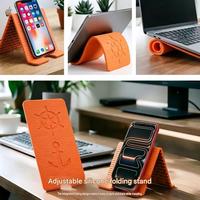 Support de téléphone en silicone, support de bureau pour tablette/ordinateur portable, anti-poussière, hauteur réglable, anti-tremblement, support pliable créatif et flexible