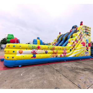 Toboggan gonflable géant à double voie pour enfants, idéal pour les fêtes foraines et les événements, avec des décorations de clown joyeux. - Product Image 6