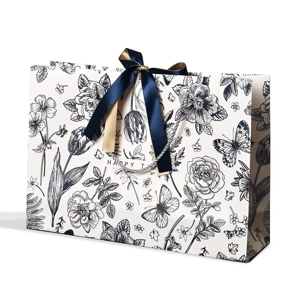 Bolsa de papel de regalo para embalaje de ropa de papel mate a la moda, bolsa de compras, bolsas de papel de lujo con asa de cinta