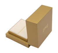 Boîte à bijoux rigide personnalisée avec gaufrage, paillettes dorées, fermeture magnétique, poignée et doublure en éponge pour le rangement de bracelets haut de gamme