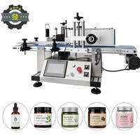 Machine d'étiquetage de bouteilles cylindriques électrique compacte de comptoir avec moteur pour l'emballage de cosmétiques, de boissons, de sacs, de cartons et de barils