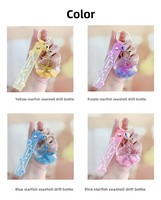 Porte-clés en acrylique en forme d'étoile de mer avec bouteille flottante pour sable mouvant, idéal pour voiture, sac à dos d'étudiant, petit cadeau, ornement suspendu