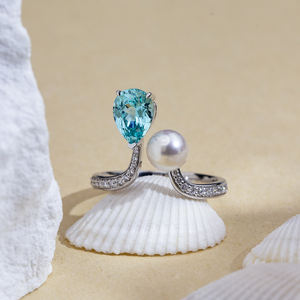 Anillo de oro de 18 quilates con dos piedras de aguamarina de laboratorio en forma de pera, modelo MSR-1633 de Messi Jewelry. - Product Image 1