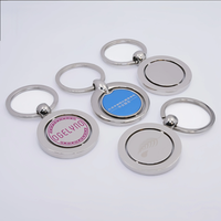 Porte-clés flottant en métal souvenir personnalisé avec rotation rotative et logo en métal Porte-clés imprimé époxy en alliage d'acier inoxydable et d'argent