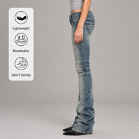 Fournisseur OEM Jeans Femme Taille Basse Coupe Bootcut en Denim Pur Coton Délavé Bleu avec Effet Whisker