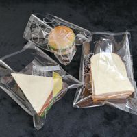 Sacs à T-shirts en BOPP autocollants écologiques, imperméables, gaufrés, de qualité alimentaire, pour emballage de vêtements, 100 pièces en gros