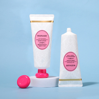 Tube cosmétique en PE blanc mat à motif vintage de 100 ml avec bouchon à vis rond rose, emballage élégant et féminin pour lotion corporelle