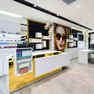 Mobilier de présentation sur mesure pour magasins d'optique,avec finitions dorées, et comptoirs d'accueil pour magasins d'optiqe - Product Image 1