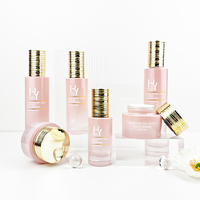 Emballage de produit de soin de la peau bouteille de lotion en verre rose dégradé de couleur personnalisée avec pompe et ensemble de récipients pour crème pour le visage