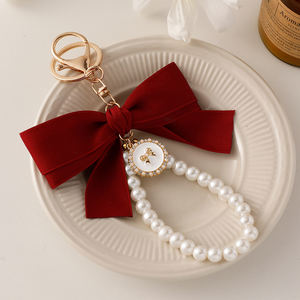 女性エレガントな甘いスタイル高級コインホルダーキーホルダーおしゃれピンクリボン真珠装飾クリエイティブ合金バッグチャームアクセサリー - Product Image 2