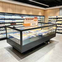 Congélateur îlot entièrement transparent avec base galvanisée personnalisable et système de refroidissement par air pour la vente de fruits de mer surgelés en supermarché