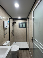 Maison conteneur moderne extensible de 20 pieds avec revêtement en poudre noire, façade en verre trempé respirant pour bureau de direction, appartement, hôtel