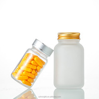 Boîte d'emballage pharmaceutique en verre rond clair/givré de 100ml 120ml 150ml pour pilules et suppléments Sceau de sécurité avec bouchon à vis