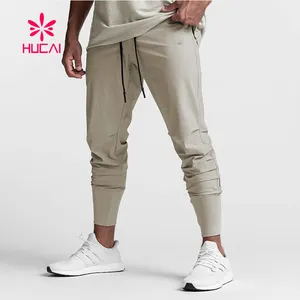 Фирменная облегающая тренировочная одежда из полиэстера, обтягивающие штаны для фитнеса с пользовательским логотипом, мужские спортивные штаны для спортзала, мужские джоггеры