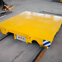 Chariot de transport robuste conçu pour le déplacement sûr et efficace des matériaux sur les sols des ateliers et dans les entrepôts
