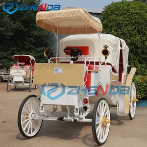 Caravane vintage à toit plat avec pompons blancs, idéale pour un voyage romantique, et bus électrique de tourisme avec sièges rouges. - Product Image 2